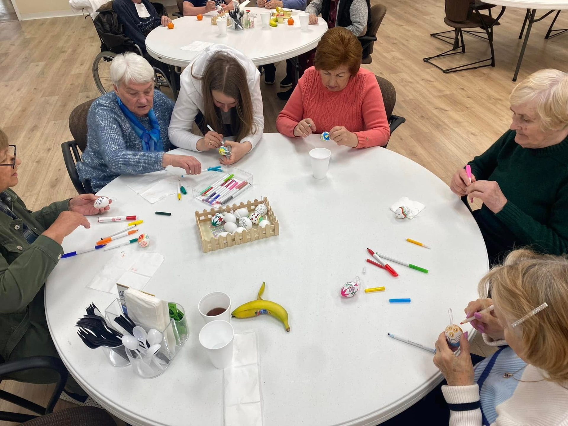 Participants at our adult day care center in Philadelphia working on a craft together